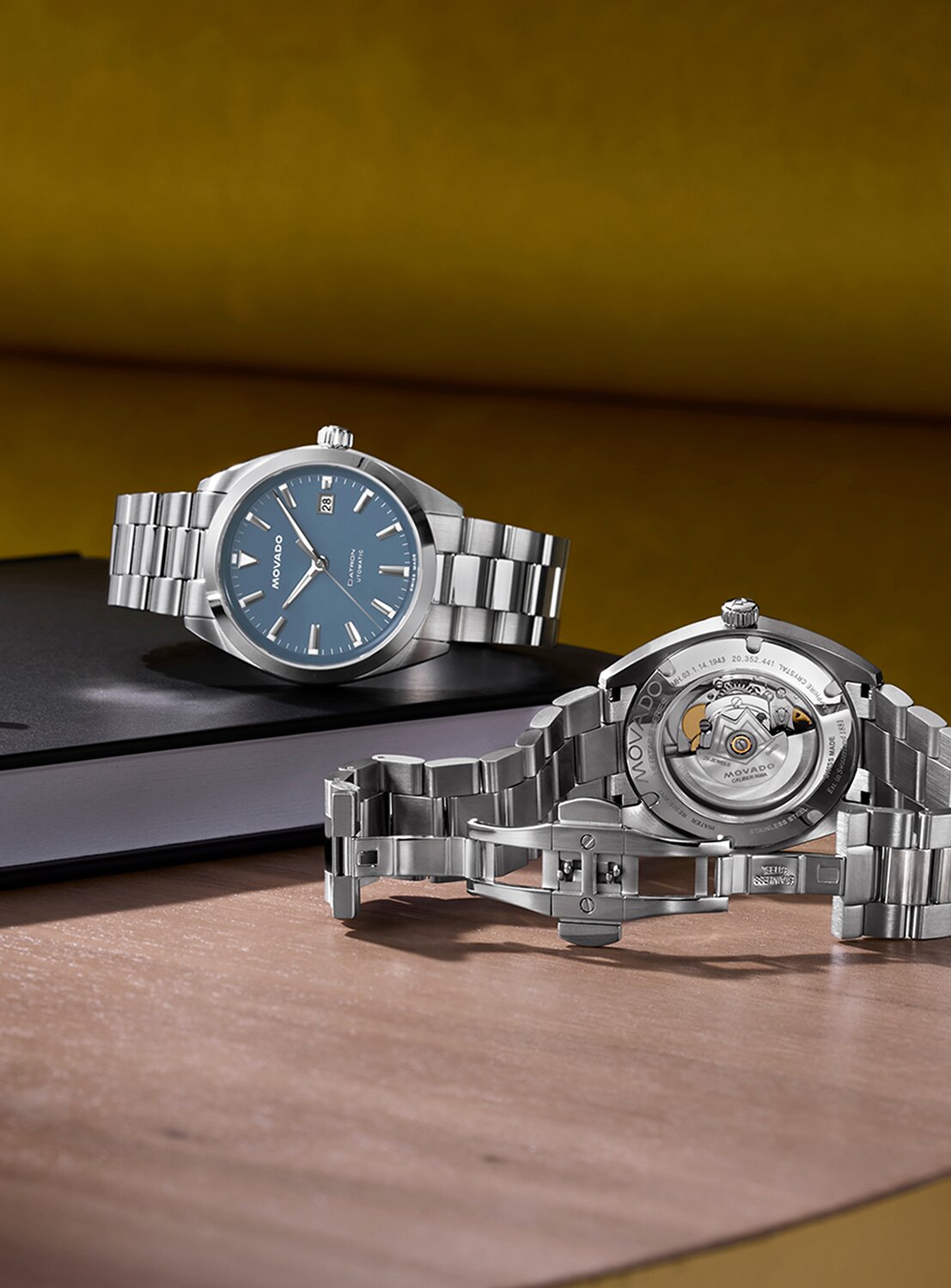 Front and backside of the Datron automatic watch with silver bracelet and blue dial
