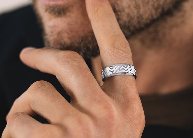 Silver men's chevron ring on a mans finger