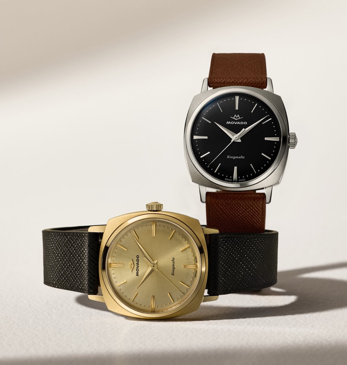 Heritage Kingmatic watch with brown strap and black square dial and black strap and gold square dial.