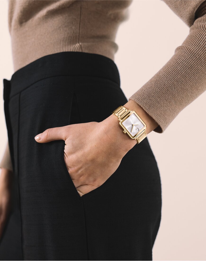 Two Tone Museum Classic bracelet watch featuring lab grown diamonds in front of a yellow background.