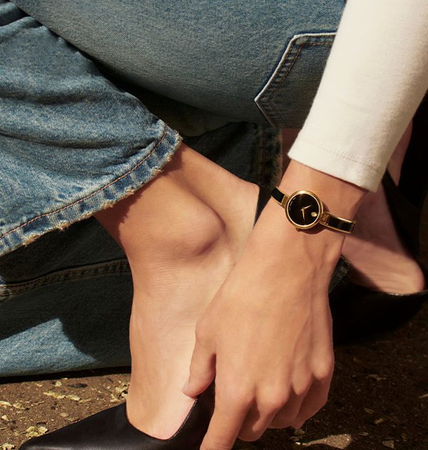 Black Moda bangle watch on a women's wrist