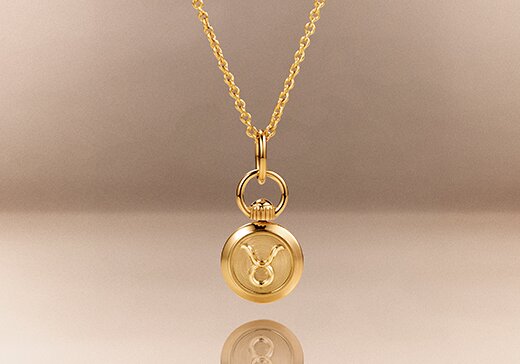 Gold tone taurus zodiac charm necklace
