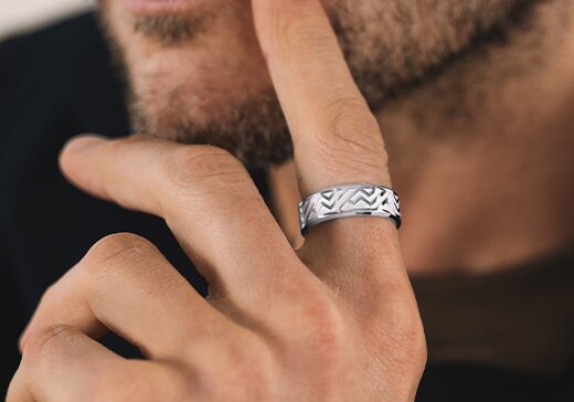 Silver men's chevron ring on a mans finger