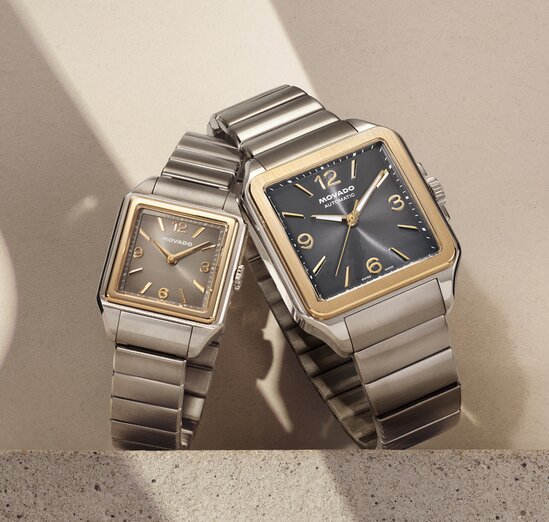 Men's and women's two tone Heritage 1917 bracelet watches with square dials.