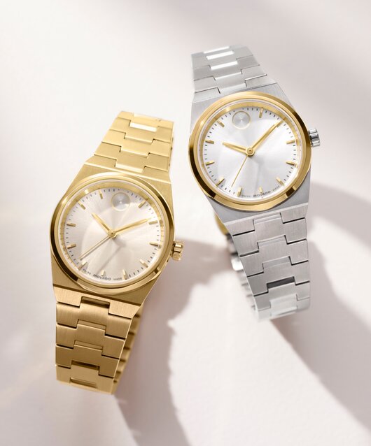 Gold tone BOLD Quest Mini bracelet watch next to a Stainless steel BOLD Quest Mini bracelet watch with gold accents.
