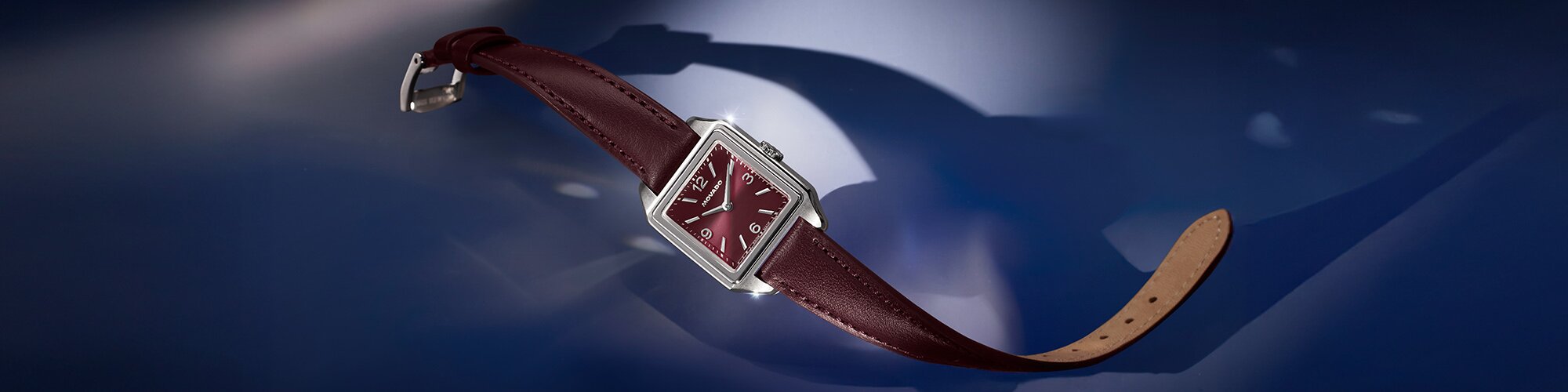 Heritage 1917 cherry watch with leather strap and square dial.
