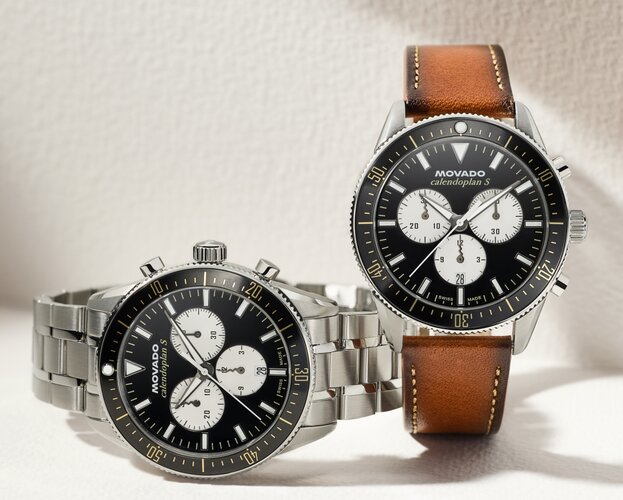 Heritage Calendoplan S watch with stainless steel bracelet and black chronograph dial next to the Heritage Calendoplan S watch with brown leather strap and black chronograph dial.