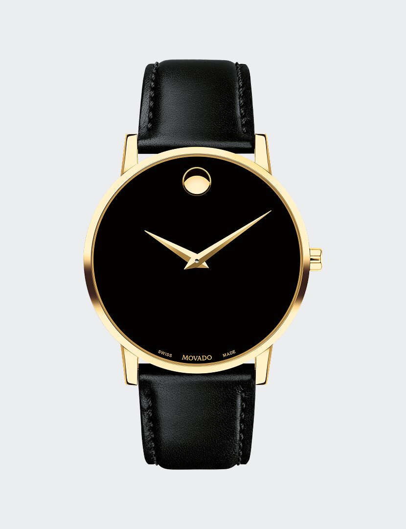 Black Museum Classic watch with leather strap and gold tone accents.