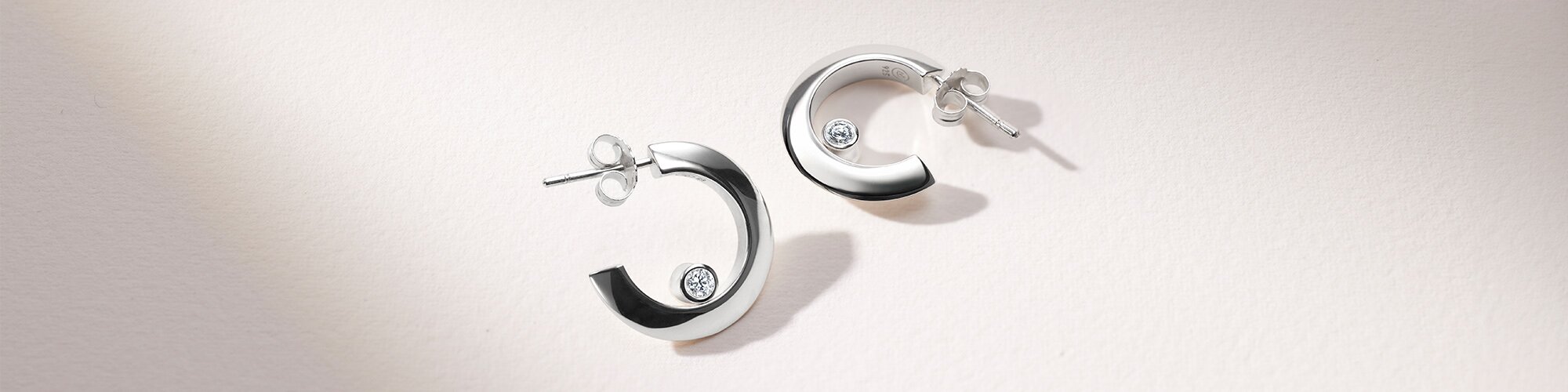 Silver Ono hoop earrings with lab grown diamonds.