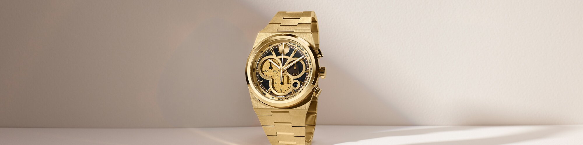 Gold tone BOLD Quest bracelet watch with chronograph skeleton dial.
