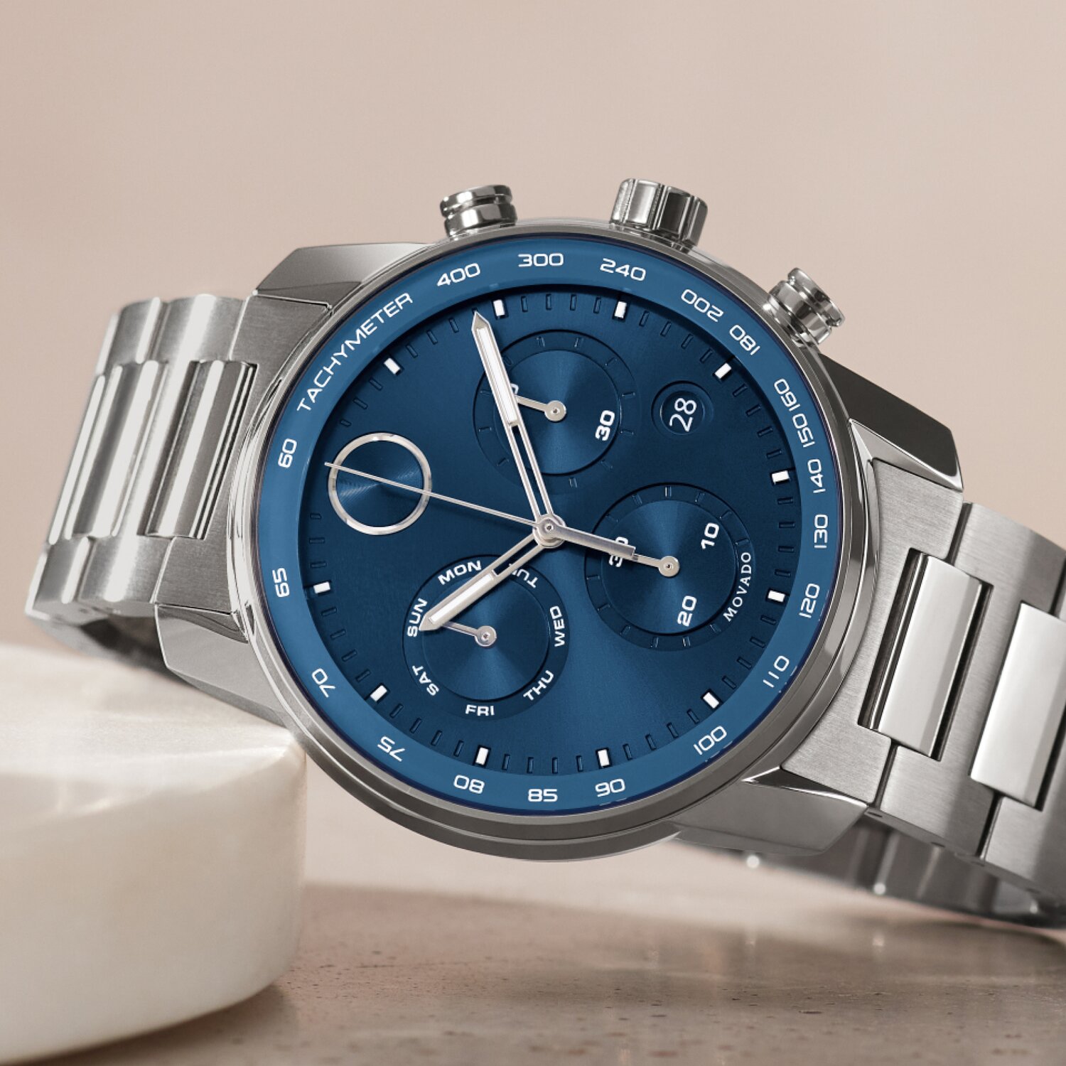 BOLD Verso watch with blue chronograph dial and silver bracelet laying down