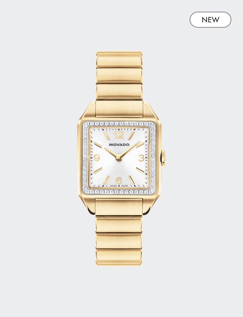 Gold tone Heritage 1917 bracelet watch with silver square dial, lab grown diamond bezel and "new" badge in the top right corner.