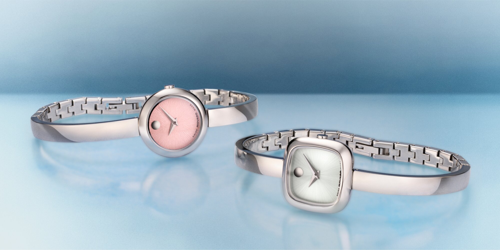 Gold tone Museum Bangle with a circle dial, next to a, Gold tone Museum Bangle with a square dial, next to a, Gold tone Museum Bangle with an oval dial.