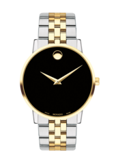 Museum Classic watch with two tone bracelet and black dial with gold accents.