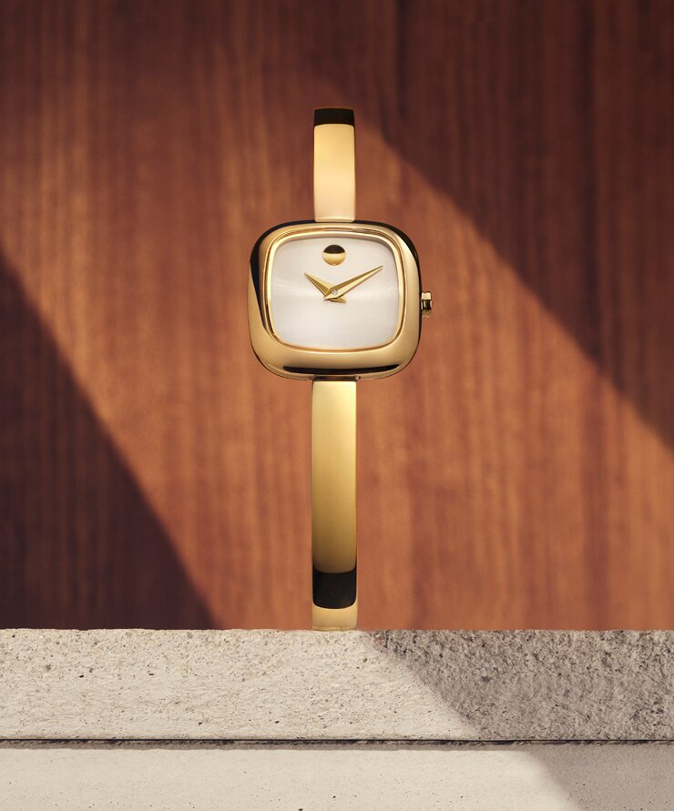 Gold tone Museum Bangle watch with white square dial.