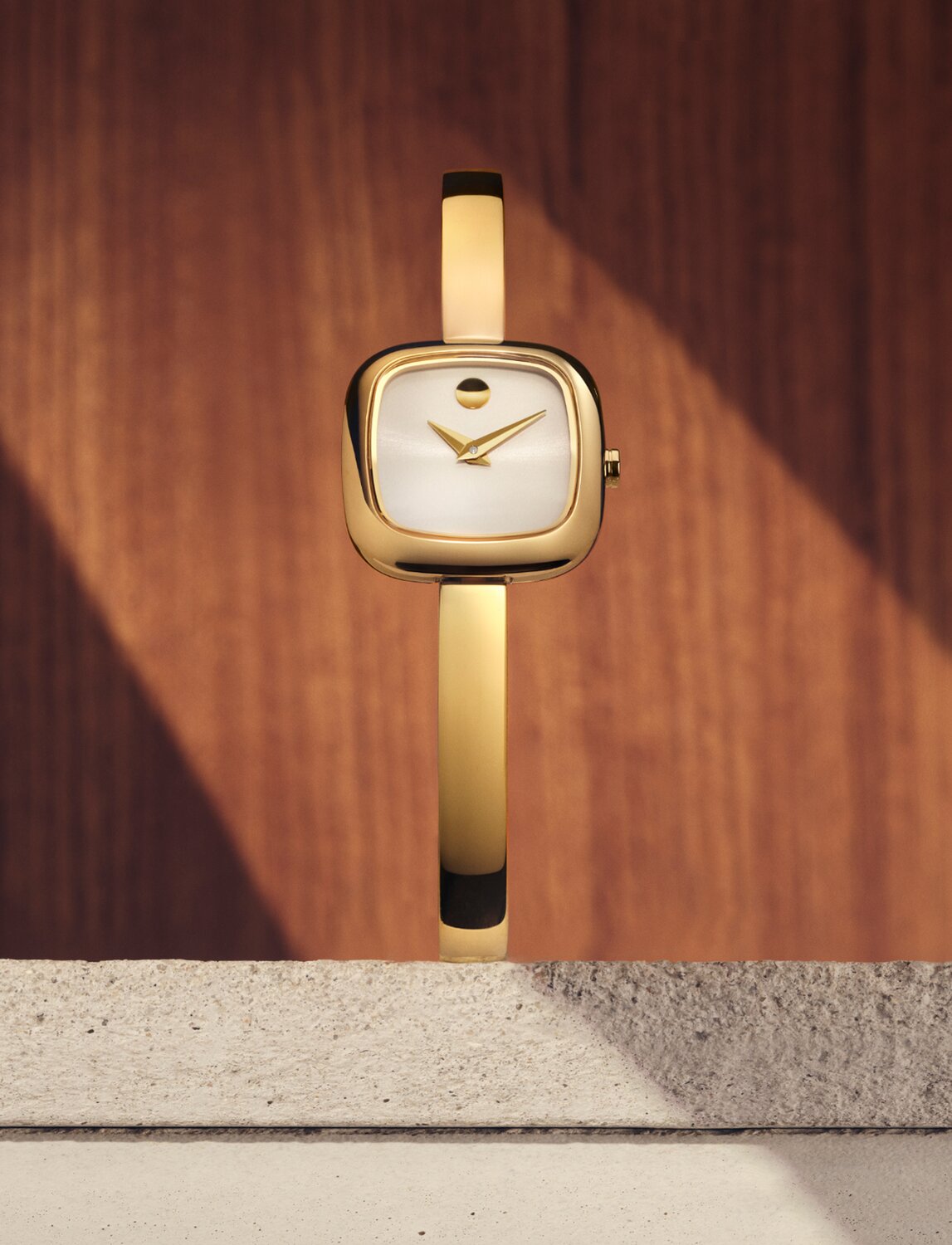 Gold tone Museum Bangle watch with white square dial.