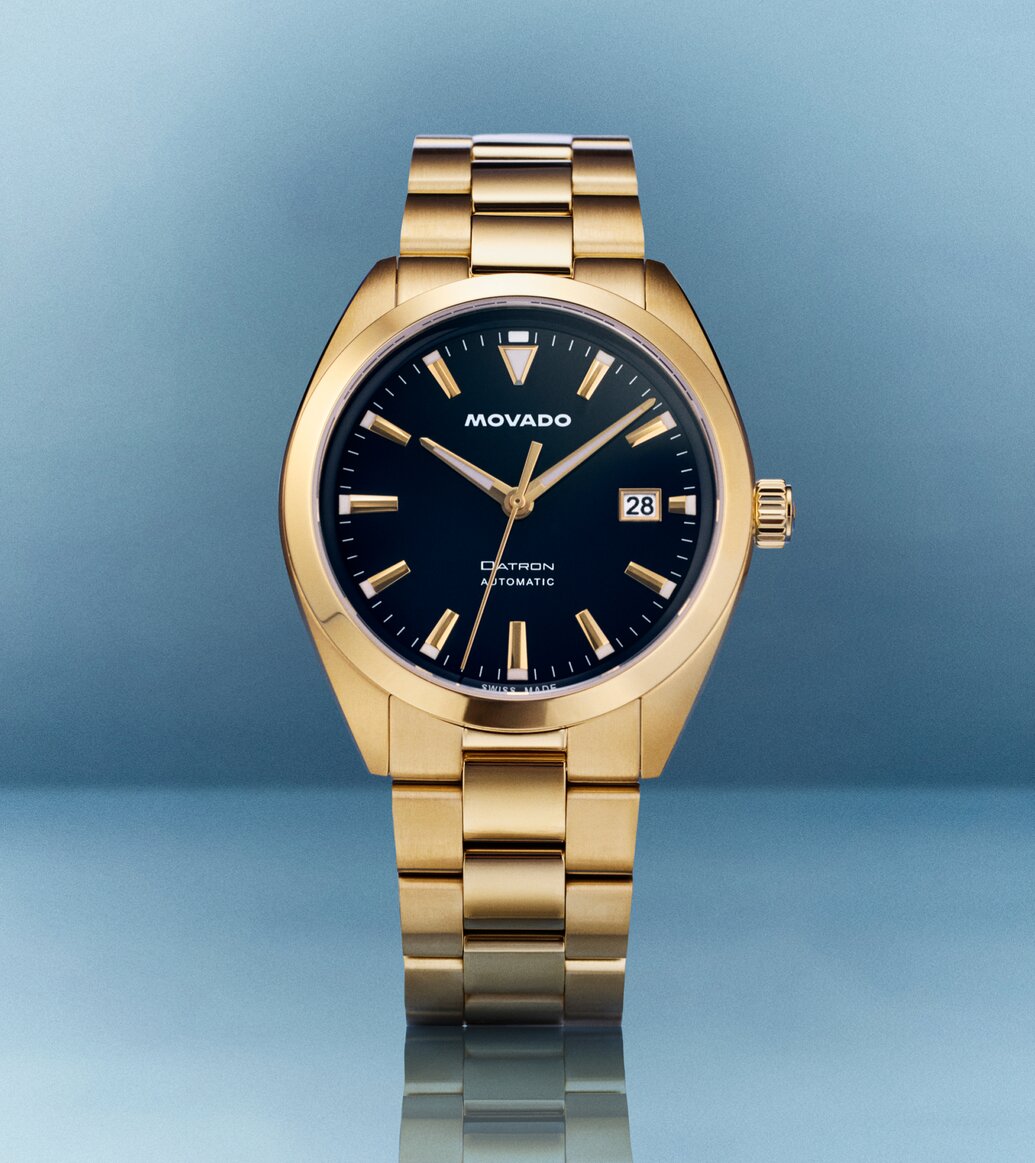 Heritage Datron watch with gold tone bracelet and blue dial.