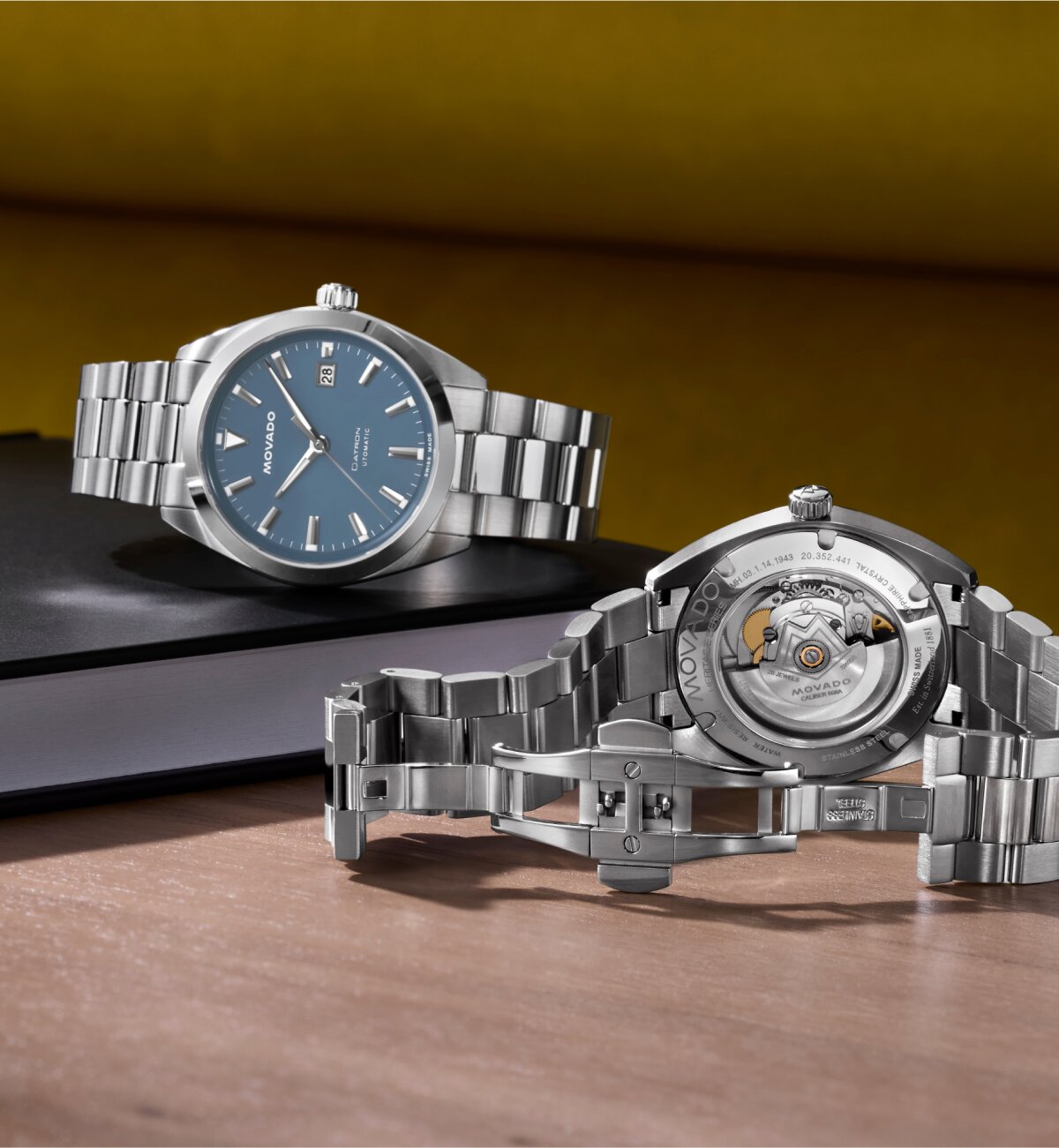 Front and backside of the Datron automatic watch with silver bracelet and blue dial