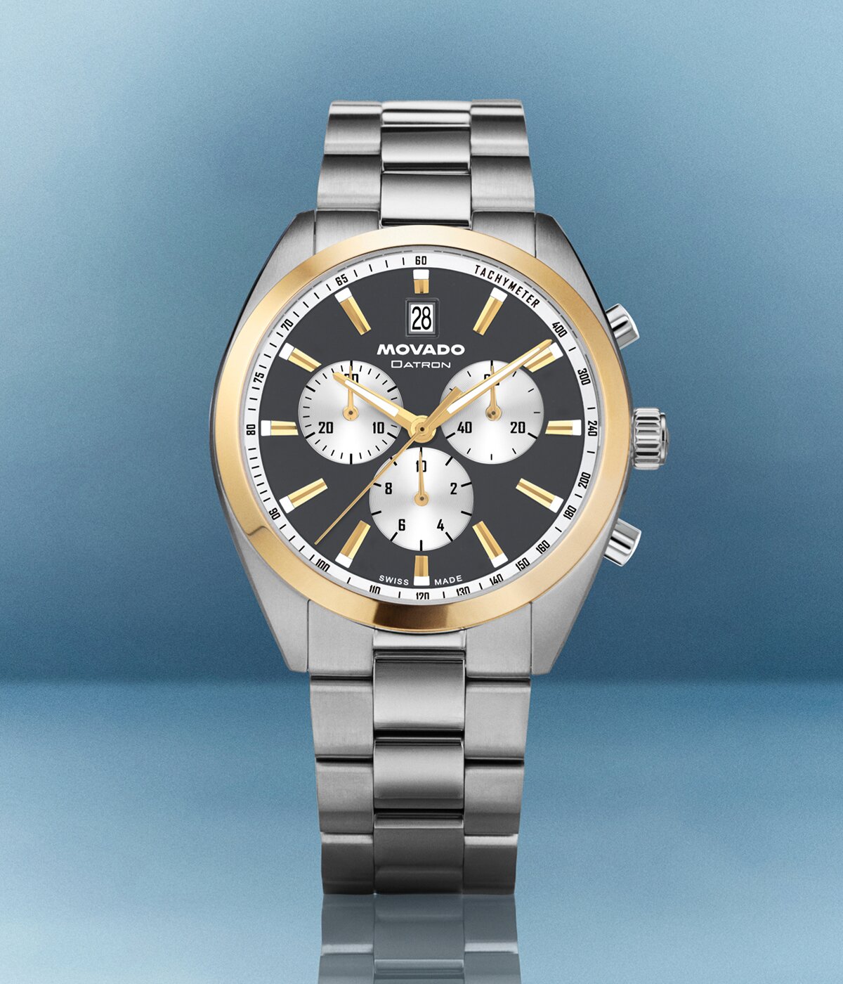 Heritage Series Datron watch with silver bracelet and blue chronograph dial with gold tone accents.