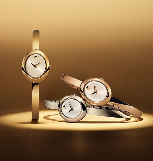 Three Museum Bangle watches with oval dial in gold tone, silver and rose gold tone.