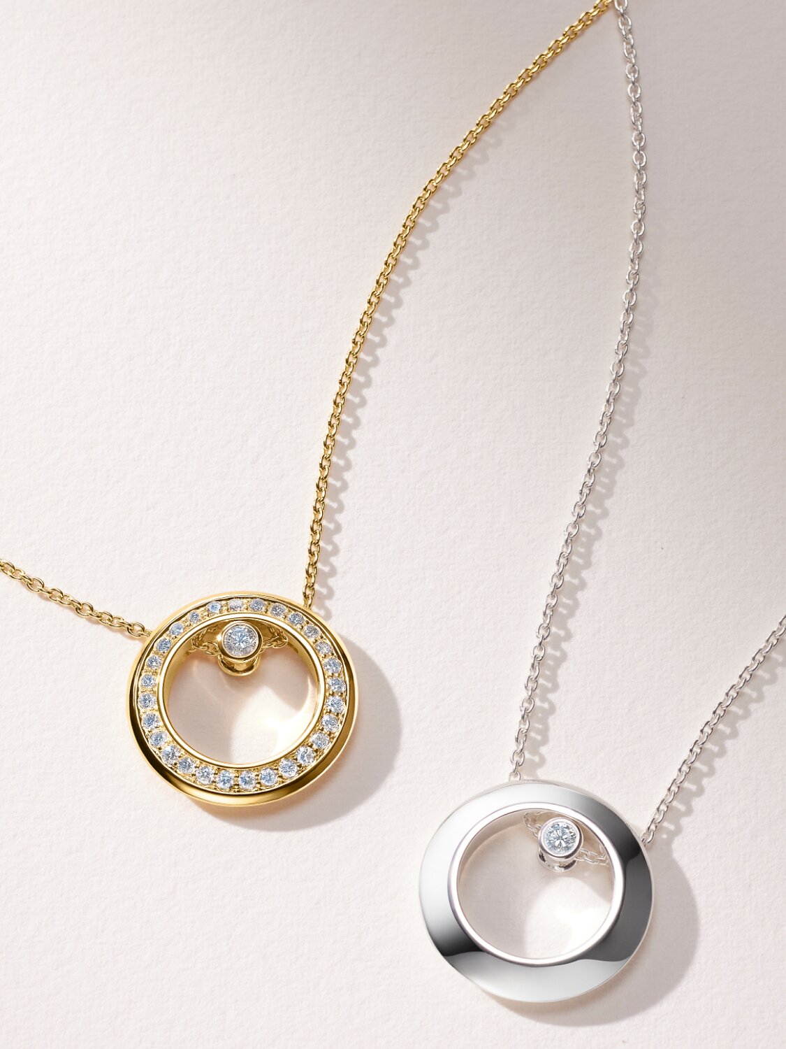 Gold tone Ono necklace with lab grown diamonds and sterling silver Ono Necklace with one lab grown diamond.