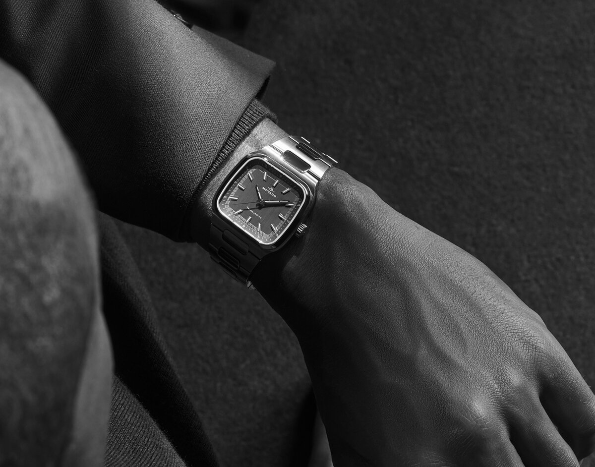 Black and white image of someone wearing the Tempo-Matic bracelet watch with TV-Shaped case.
