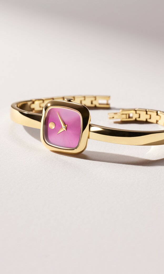 Gold tone Museum Bangle watch with pink square dial.