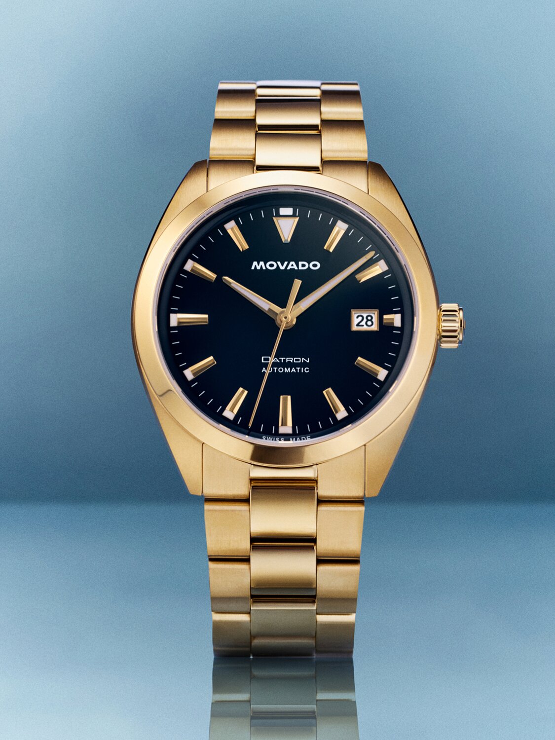 Heritage Series Datron Automatic watch with gold tone bracelet and navy blue dial.