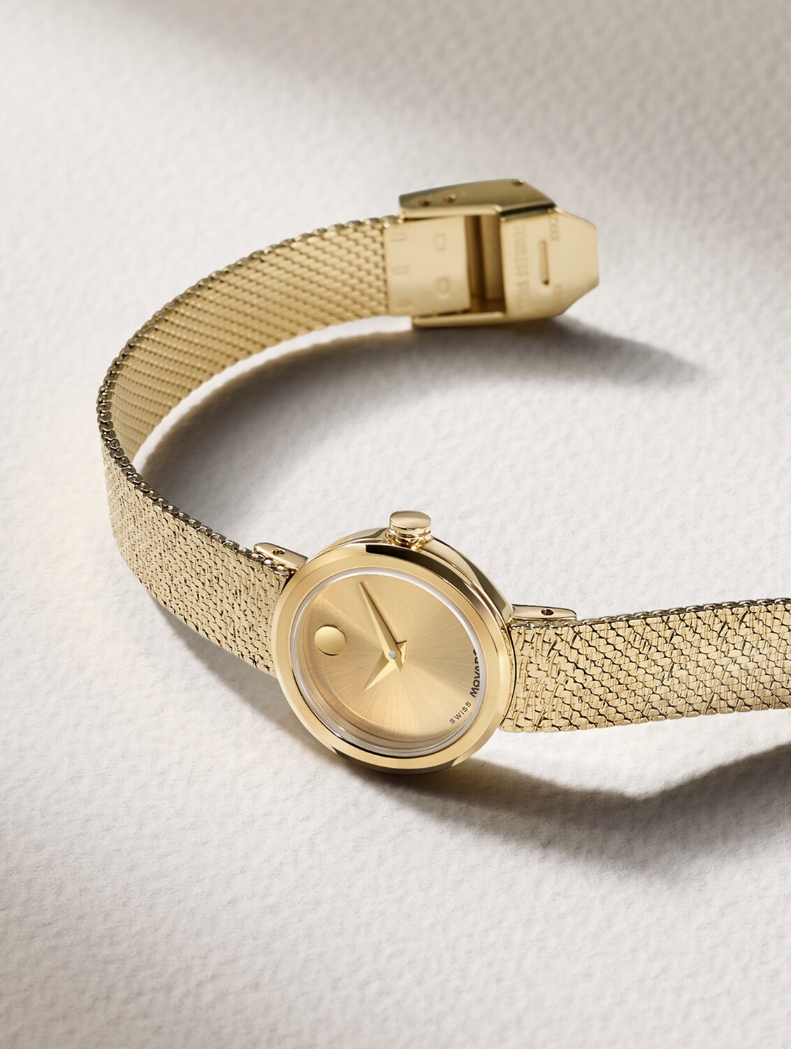 Gold tone Museum Velura Mini watch with mesh bracelet.