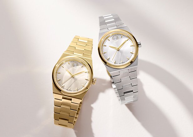 Gold tone BOLD Quest Mini bracelet watches next to a two tone BOLD Quest Mini bracelet watch.