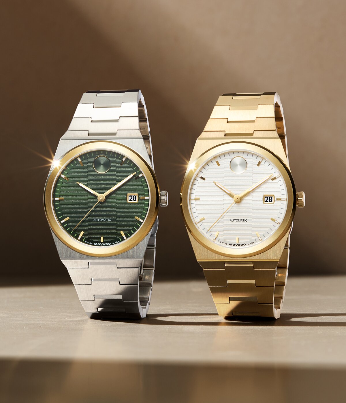 BOLD Quest watch with stainless steel bracelet and green textured dial next to a BOLD Quest watch with gold tone bracelet and white textured dial.