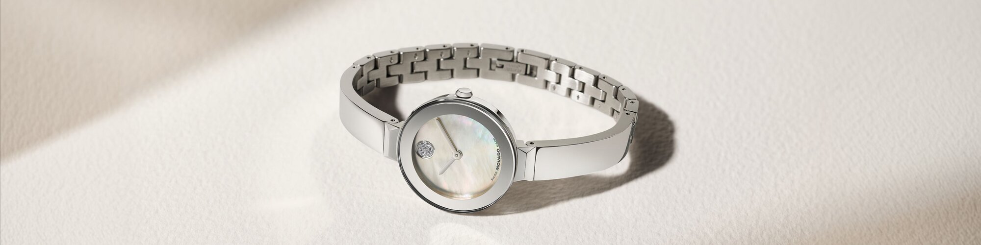 Stainless Steel BOLD Bangle watch with silver mother of pearl dial and crystal dot.