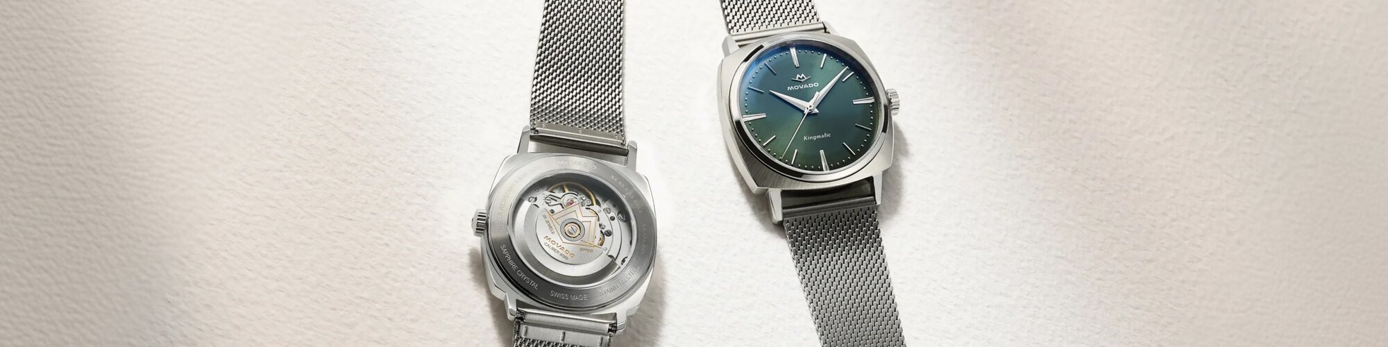 Front and back of the Heritage Kingamtic watch with stainless steel mesh bracelet and blue dial with exposed case back.