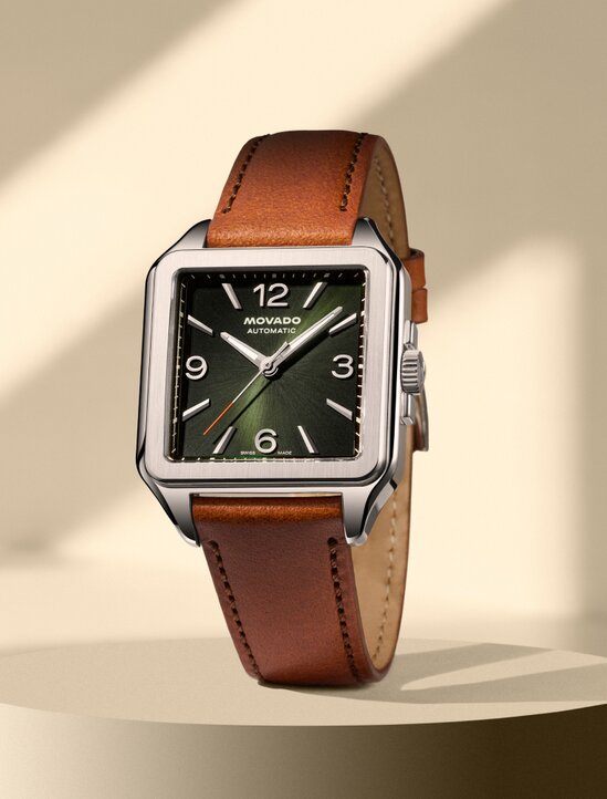 Heritage 1917 watch with brown strap and green square dial with stainless steel accents.