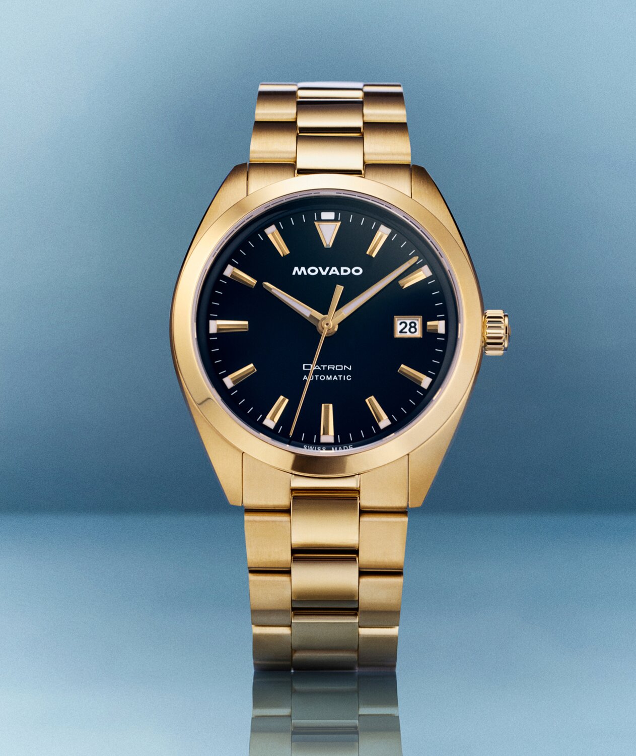 Heritage Series Datron Automatic watch with gold tone bracelet and navy blue dial.