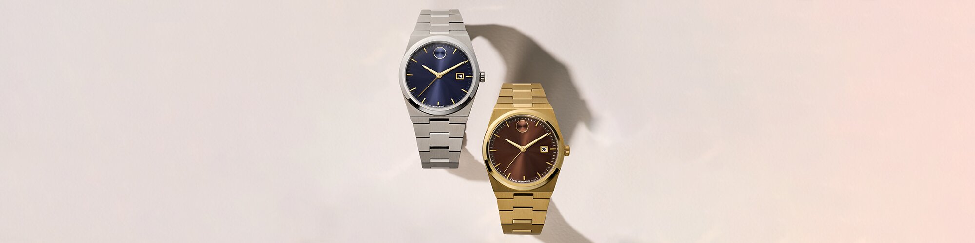 Stainless Steel BOLD Quest bracelet watch with blue dial and gold tone BOLD Quest bracelet watch with brown dial.