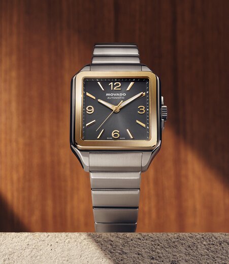 Heritage 1917 watch with stainless steel bracelet and square grey dial.