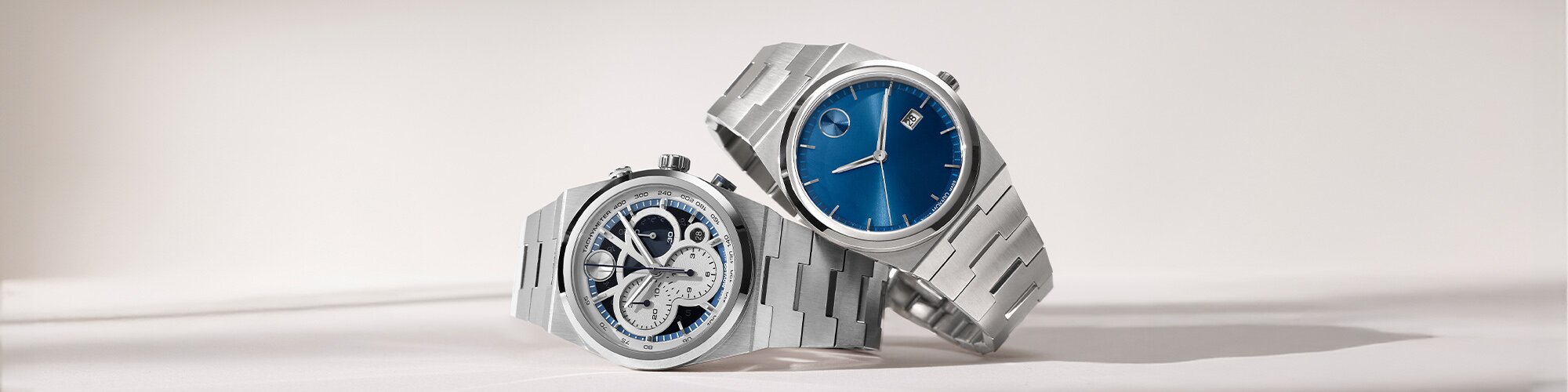 BOLD Quest watch with stainless steel bracelet with blue skeleton dial underneath a BOLD Quest watch with stainless steel bracelet and blue dial.