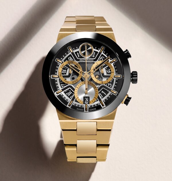 BOLD Fusion Chronograph watch with gold tone bracelet and black and gold skeleton dial.