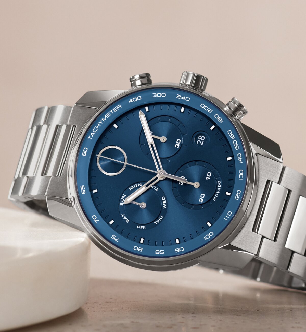 BOLD Verso watch with blue chronograph dial and silver bracelet laying down