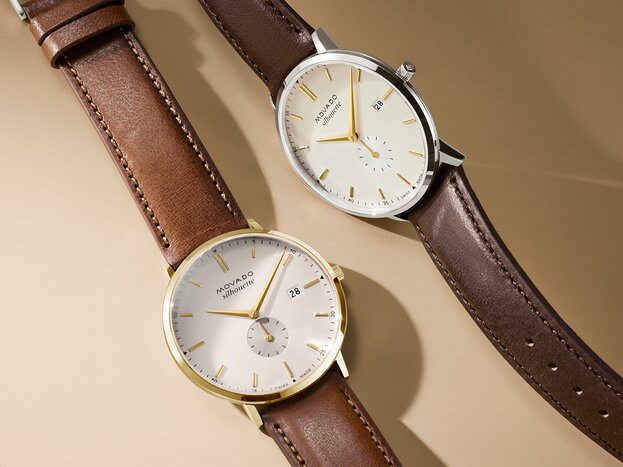 Heritage Silhouette watch with light brown leather strap and white dial next to the Heritage Silhouette watch with dark brown leather strap and white dial.
