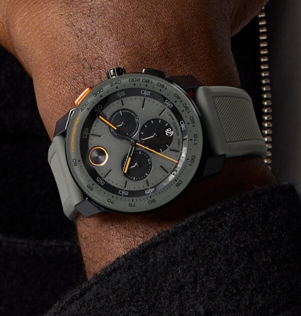 Man wearing the BOLD TR90 Chronograph watch with grey silicon strap and grey dial with black sub dials.