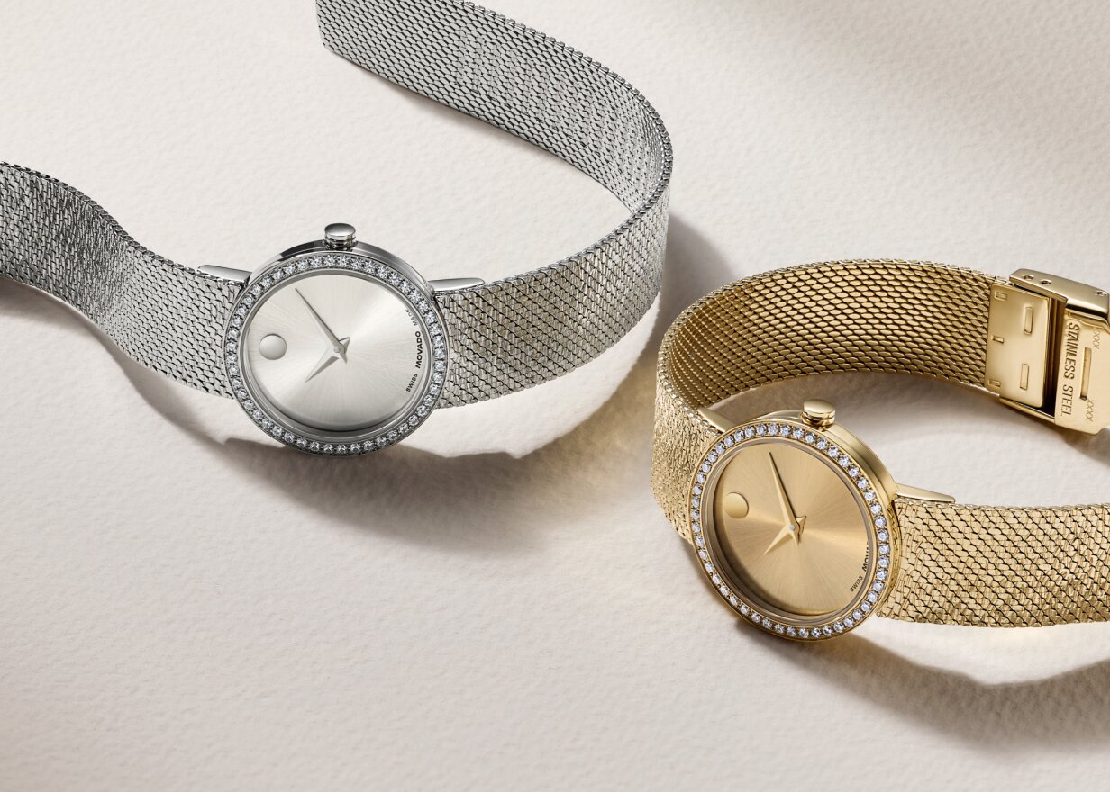 Stainless Steel Museum Velura watch with mesh bracelet and lab grown diamonds next to a gold tone Museum Velura with lab grown diamonds.