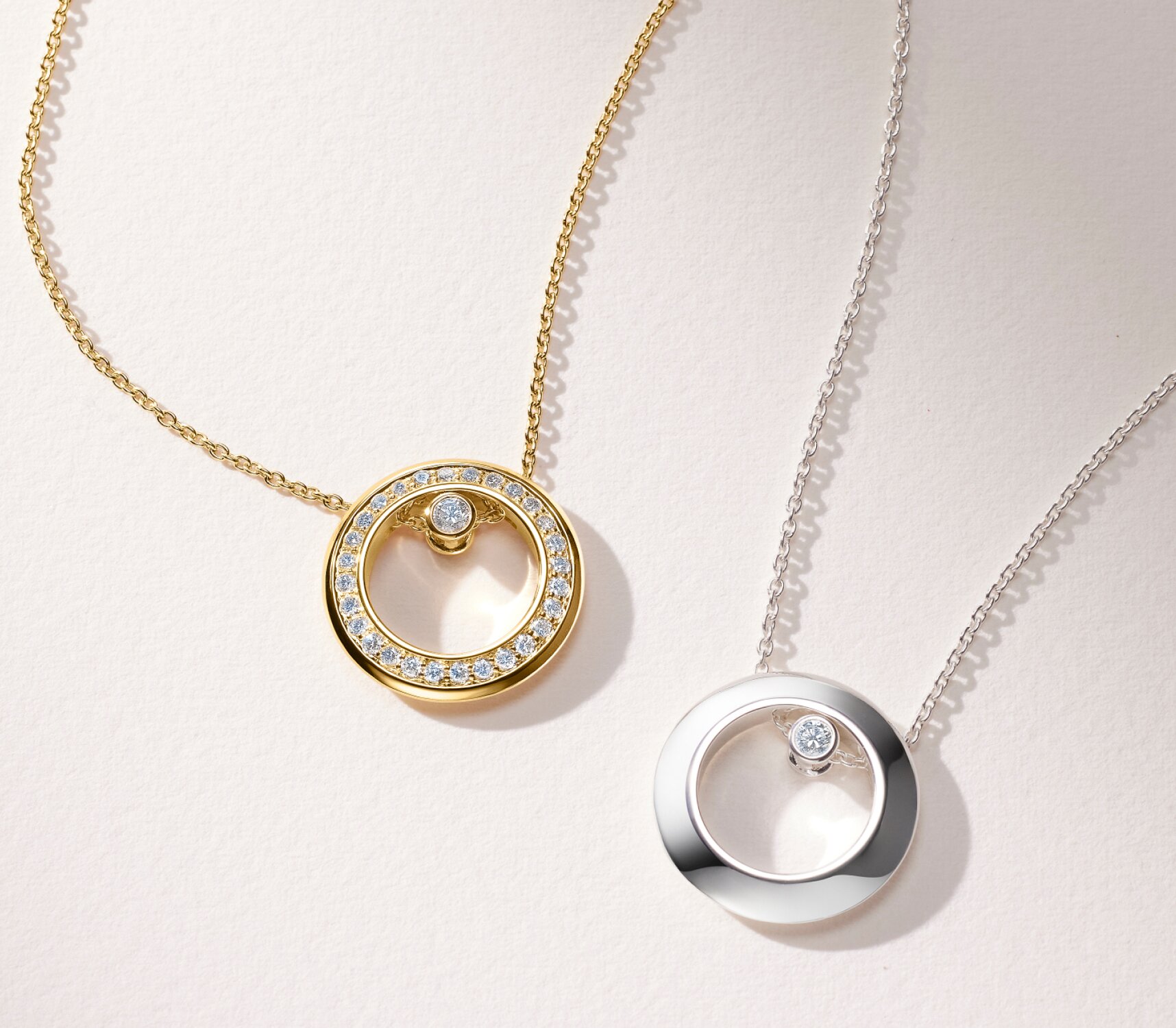 Gold tone Ono necklace with lab grown diamonds and sterling silver Ono Necklace with one lab grown diamond.