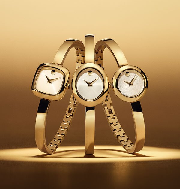 Three gold tone Museum Bangles watches with square, oval and circle dials. 