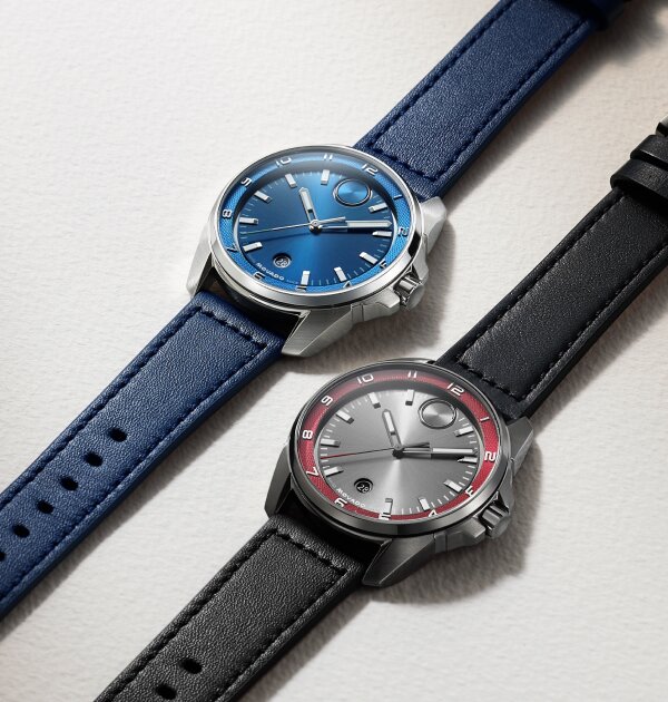 Bold Verso S watch with blue leather strap and dial laying next to a BOLD Verso S watch with black leather strap, grey dial and red hour track.