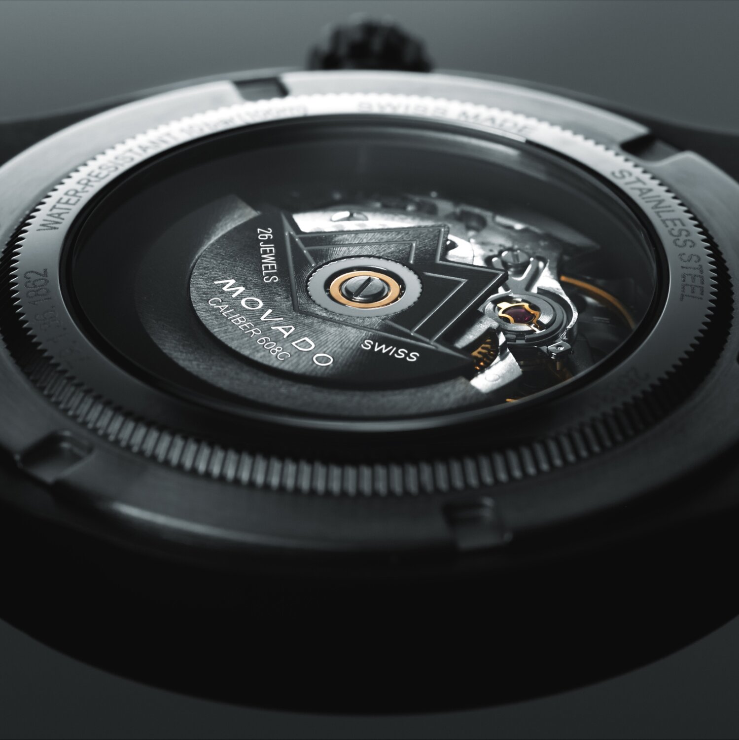 Black Movado SE Automatic caseback featuring a window that displays the automatic movement.