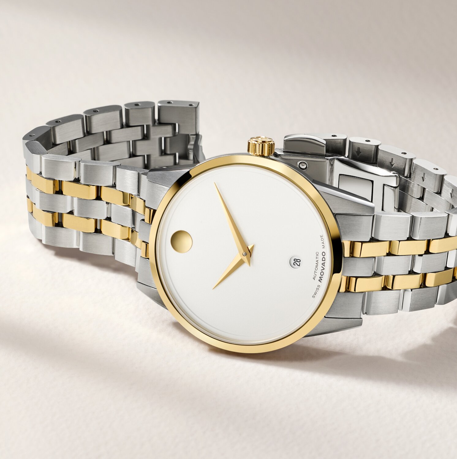 Museum Classic watch with two tone bracelet and white dial.
