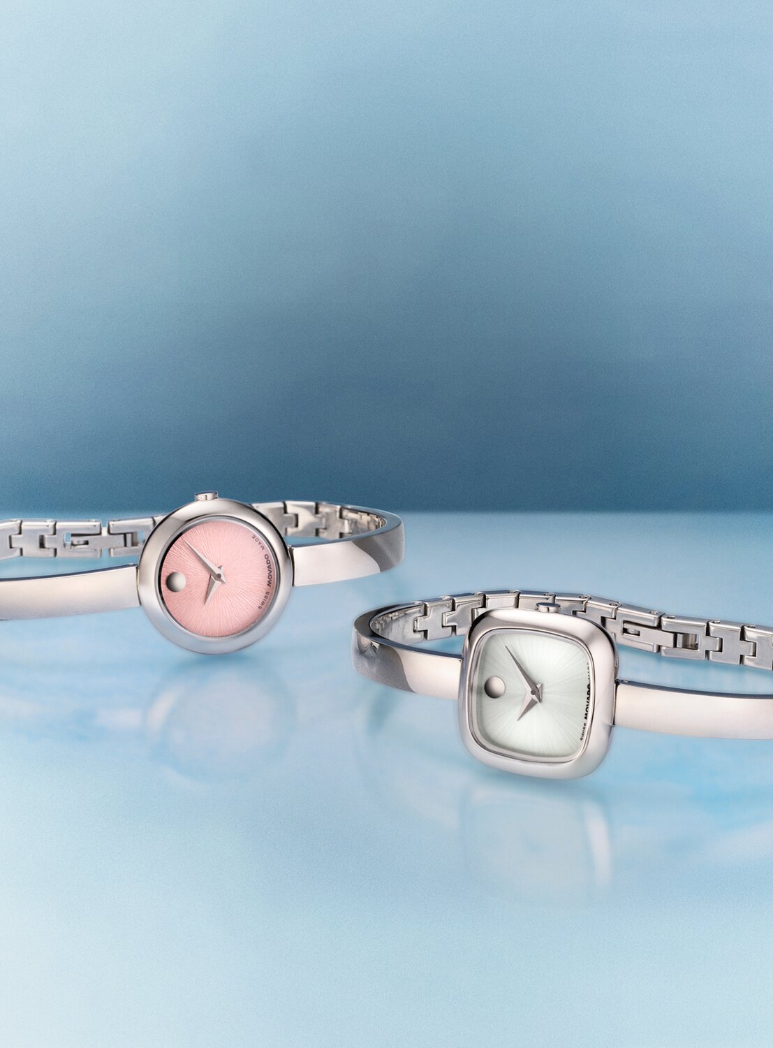 Three gold tone Museum Bangle watches; circle dial, square dial and oval dial.