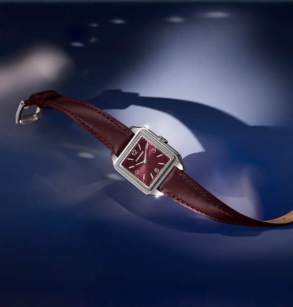 Heritage 1917 cherry watch with leather strap and square dial.